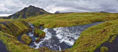 Hestavaosfoss, Fosstorufoss, Steinbogafoss waterfalls above Skogafoss waterfall summer 2024 Ring Road South coast of Iceland, Scandinavia, Europe. clipart