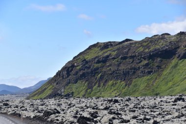 South Coast Iceland landscape by ocean with lava rock covered in white Lichens and Moss by Fagradalsfjall Volcano, Scandinavia, Europe clipart