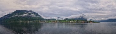 Norway Coast Fjord view from boat on ocean. Mountains, forests, waterfalls and small towns. Scandinavia, Norway clipart