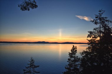 San Juan Islands dusk sunset treeline coast views fro Lopez Island summer 2024, archipelago Washington, United States clipart