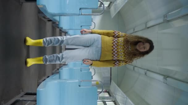 Curly Haired Tourist Yellow Boots Stands Blue Seats Empty Train — Stock video