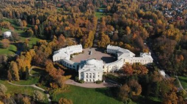 Aerial view of the pavlovsk castle in the autumn park in the suburbs of st. petersburg in sunny weather. Castle museum, historical heritage.