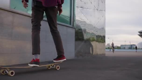 Adventurous Man Enjoys Riding Skateboard Street Big City Young Guy — Stock Video