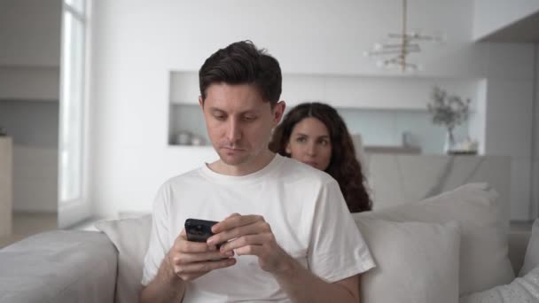 Jealous Wife Hides Sofa Spies Correspondence Her Husbands Phone Jealousy — Vídeo de stock