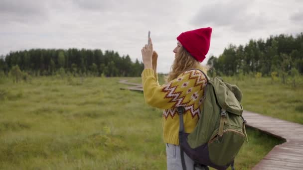 Young Woman Red Hat Takes Picture Forest Standing Meadow Hiker — 비디오