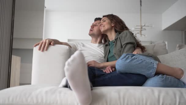 Newlyweds Dark Hair Casual Clothes Hug Sitting Sofa Living Room — Wideo stockowe
