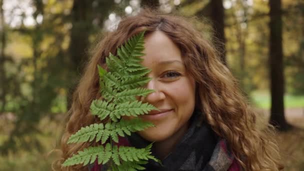 Portrait Woman Flowing Hair Covers One Half Her Face Fern — Stock video