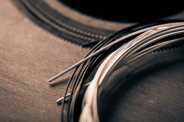 abstract new nylon core guitar strings. Restring classical guitar string concept.