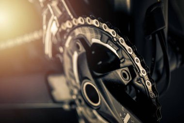 Closeup the chain and front Derailleur on the moutain bike over black background.