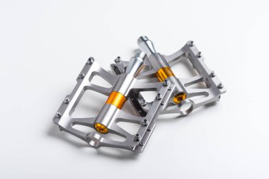 isolate lightweight aluminium bicycle pedal with titanium color. bicycle parts.