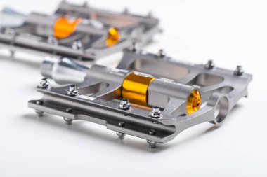 isolate lightweight aluminium bicycle pedal with titanium color. bicycle parts.