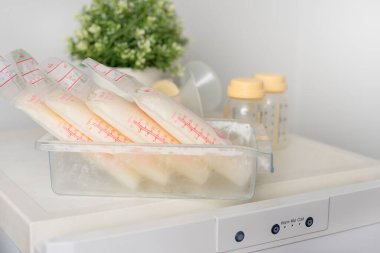 Breast milk frozen in plastic storage bags for baby. The way to store breast milk safely.