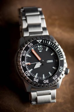 luxury men watch with black dial and stainless steel bracelet.