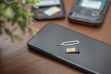 SIM card for smart phone. Changing the SIM card.