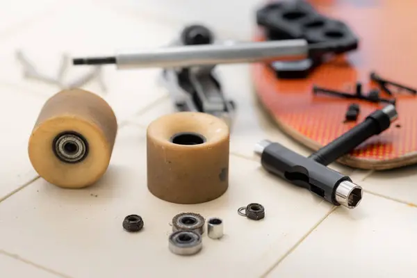 stock image Surfskate maintenance and repair concept. Selective focus on the wheel.