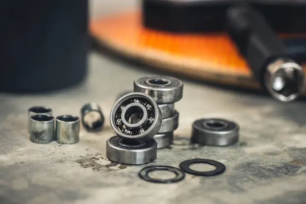 stock image Skateboard and surfskate maintenance concept. Selective focus on the bearing.