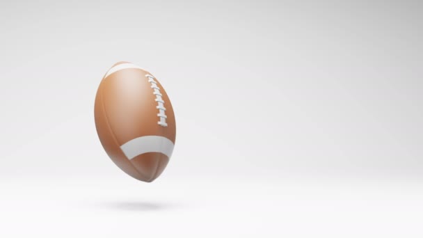 American Football Ball Spinning Studio Jasnoszary Tło Płynna Pętla Animacja — Wideo stockowe