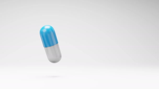 One Blue White Pill Spinning Studio Light Gray Background Seamless — Vídeos de Stock
