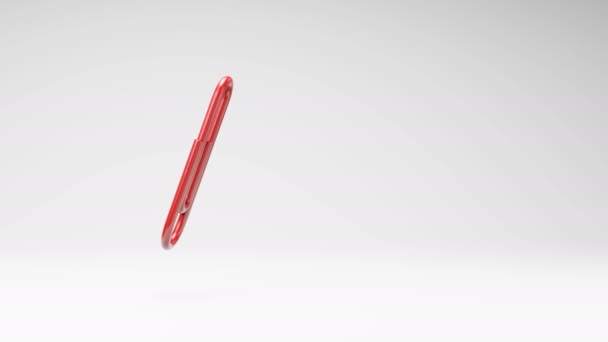 Een Red Paperclip Spinning Een Studio Lichtgrijze Achtergrond Naadloze Lus — Stockvideo