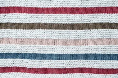 Örgü arka plan. Çizgili pamuk kumaşın dokusu yakın..
