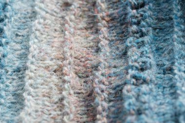 Örgü arka plan. Örülmüş kumaş dokusu, saf koyun yünü, renk değişimi..