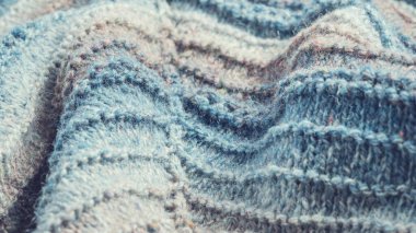 Örgü arka plan. Örülmüş kumaş dokusu, saf koyun yünü, renk değişimi..