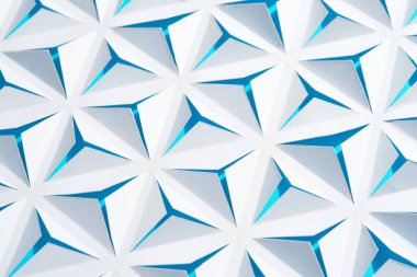 White-blue abstract paper background with triangles.