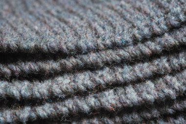 Gri örgü kumaş kıvrımları. Örülmüş doku arkaplanı.