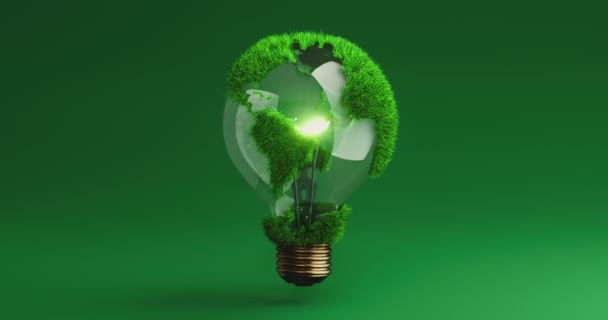 明るい電球の形で地球を回転させます 緑の草の大陸 グリーンエネルギー 地球保護 持続可能な開発 生態系 再生可能な資源 — ストック動画