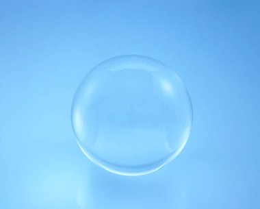 glass ball on blue background. clipart