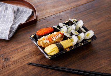 sushi set on a black wooden table