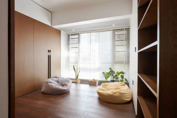 interior design of bedroom with wooden wardrobe and wooden floor