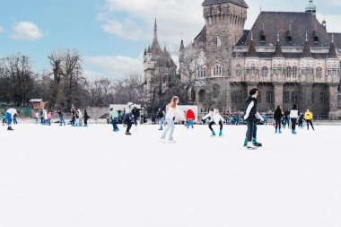 04.01.2022.Budapest.Family winter sport. Family winter sport. Soft,Selective focus.Outdoor.Learning how to skating on ice.Winter sport.Hobbies and Leisure.Winter sports.