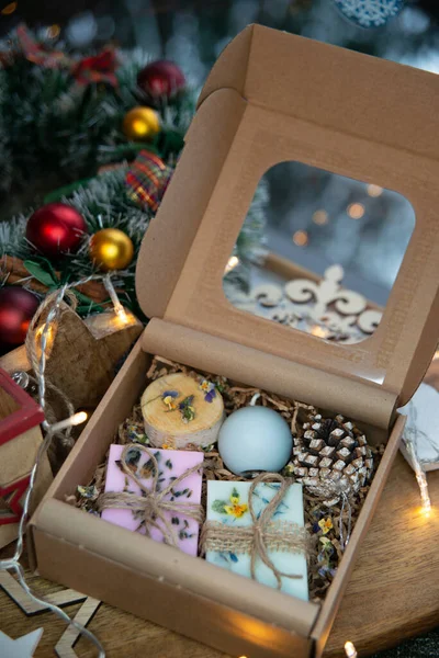 Natural handmade soap with fresh fragrance in a festive box as a gift for Christmas
