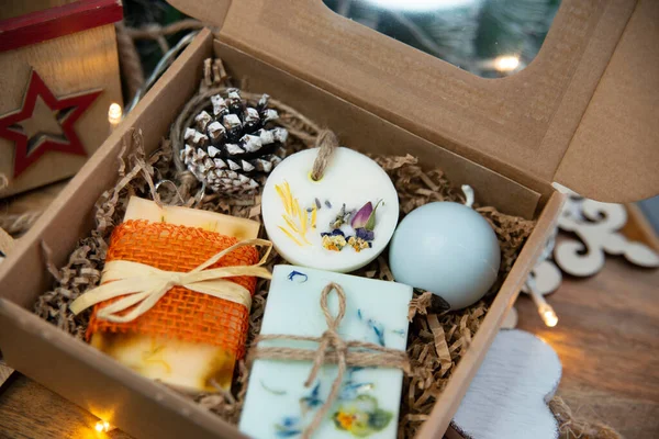 Natural handmade soap with fresh fragrance in a festive box as a gift for Christmas