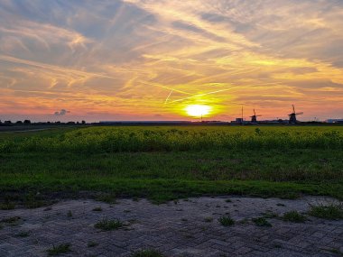 Sunset over the meadows of the Tweemanspolder in Zevenhuizen in the Netherlands
