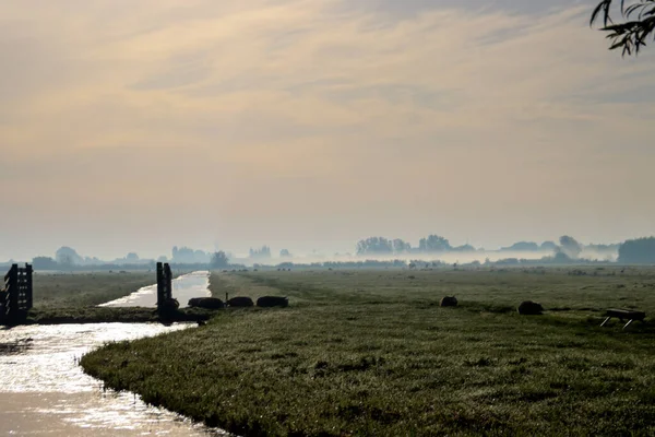 Fog over the fields of the \'s-gravenweg in the Netherlands