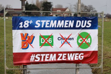 Netherlands, March 2023 -Board with protest and election advice for the provincial and water board elections in the Netherlands. Farmers are upset and put the national flag upside down. They blame current parties VVD, D66, ChristenUnie and CDA for th clipart