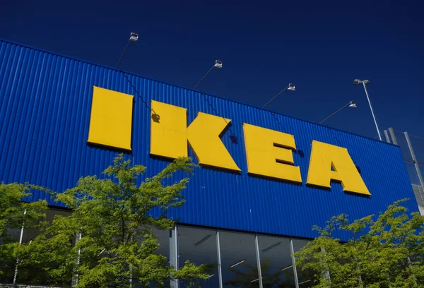 stock image Ikea furniture store logo on the wall and on flags at the store in Utrecht in the Netherlands