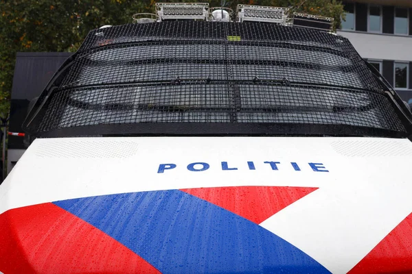 Logo and striping in front of dutch police (politie) special forces car with window protection in the Netherlands