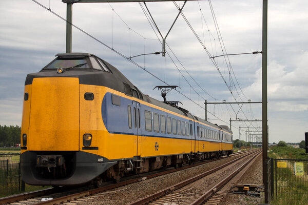 Barriers and red lights at railroad crossing in Moordrecht in the Netherlands