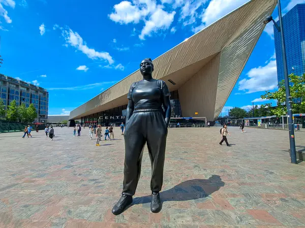 Stock image statue Moments Contained in front of Rotterdam Central Station made by Thomas J Price in the netherlands