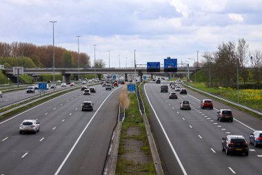 A4 motorway between Rotterdam and Amsterdam near Prins Clausplein interchange with traffic in the Netherlands clipart
