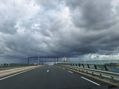Dark clouds above the Zuidplaspolder, the lowest reclaimed land of western europe destined for building houses in the Netherlands clipart