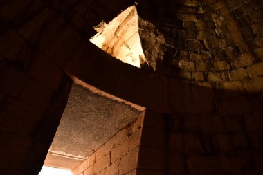 Mycenae; Greece - august 30 2022 : the tomb of Clytemnestra in the archaeological site clipart