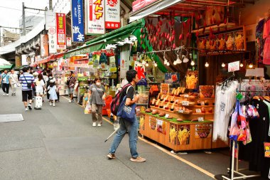 Tokyo; Japan - august 10 2024 : sweet potato chips shop in Ameya Yokocho, shopping street clipart