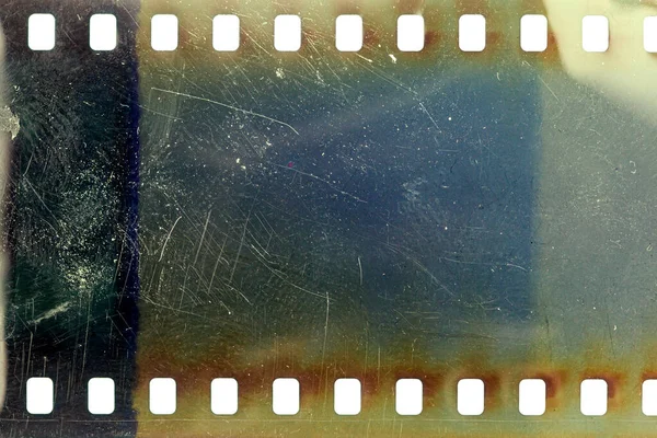 Staubige Und Grunzige 35Mm Filmstruktur Oder Oberfläche Perforierte Zerkratzte Kamerafolie lizenzfreie Stockfotos