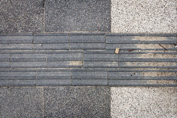 Textured Walkway Blind People Black Tactile Paving Visually Impaired Sidewalk — Stock Photo, Image