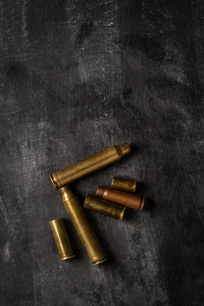 Empty Bullet Cartridges Lying Black Background —  Fotos de Stock