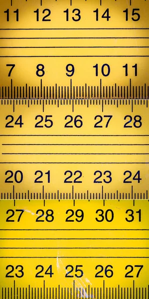 Collection of images with yellow metal ruler close ups with millimeters and centimeters
